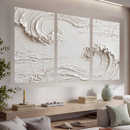 White plaster wave art set of 3 poster prints in a living room above a console