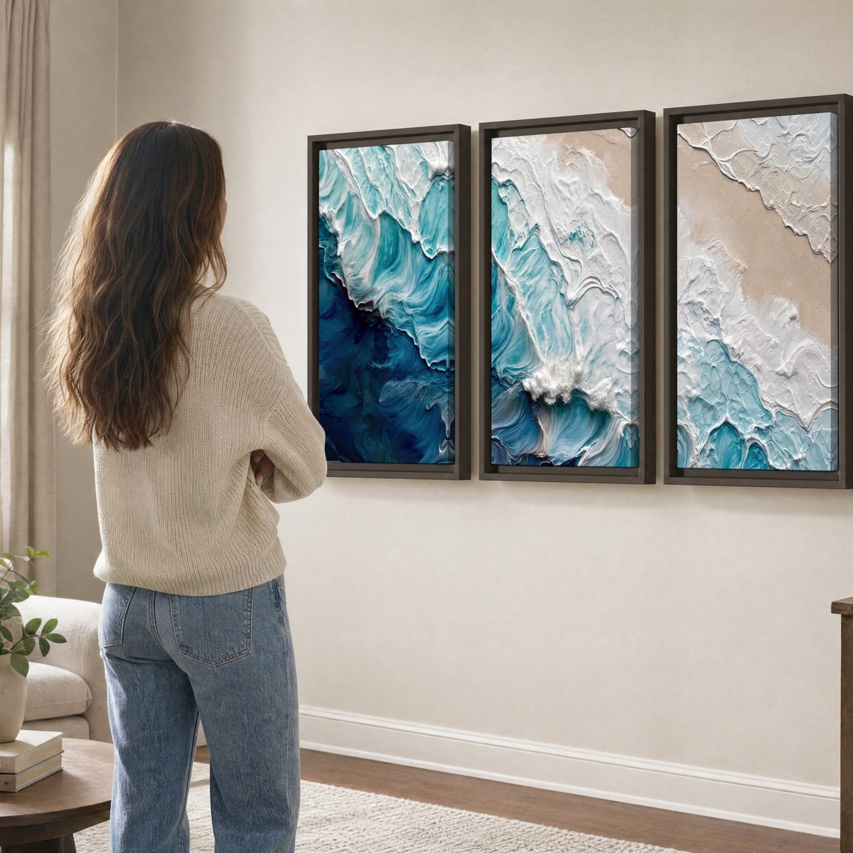Turquoise ocean wave painting 3 piece framed canvas in a living room