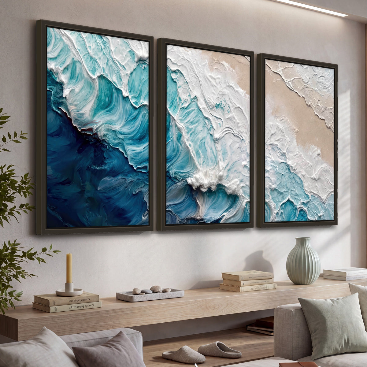 Turquoise ocean wave painting 3 piece framed canvas in a living room above a console
