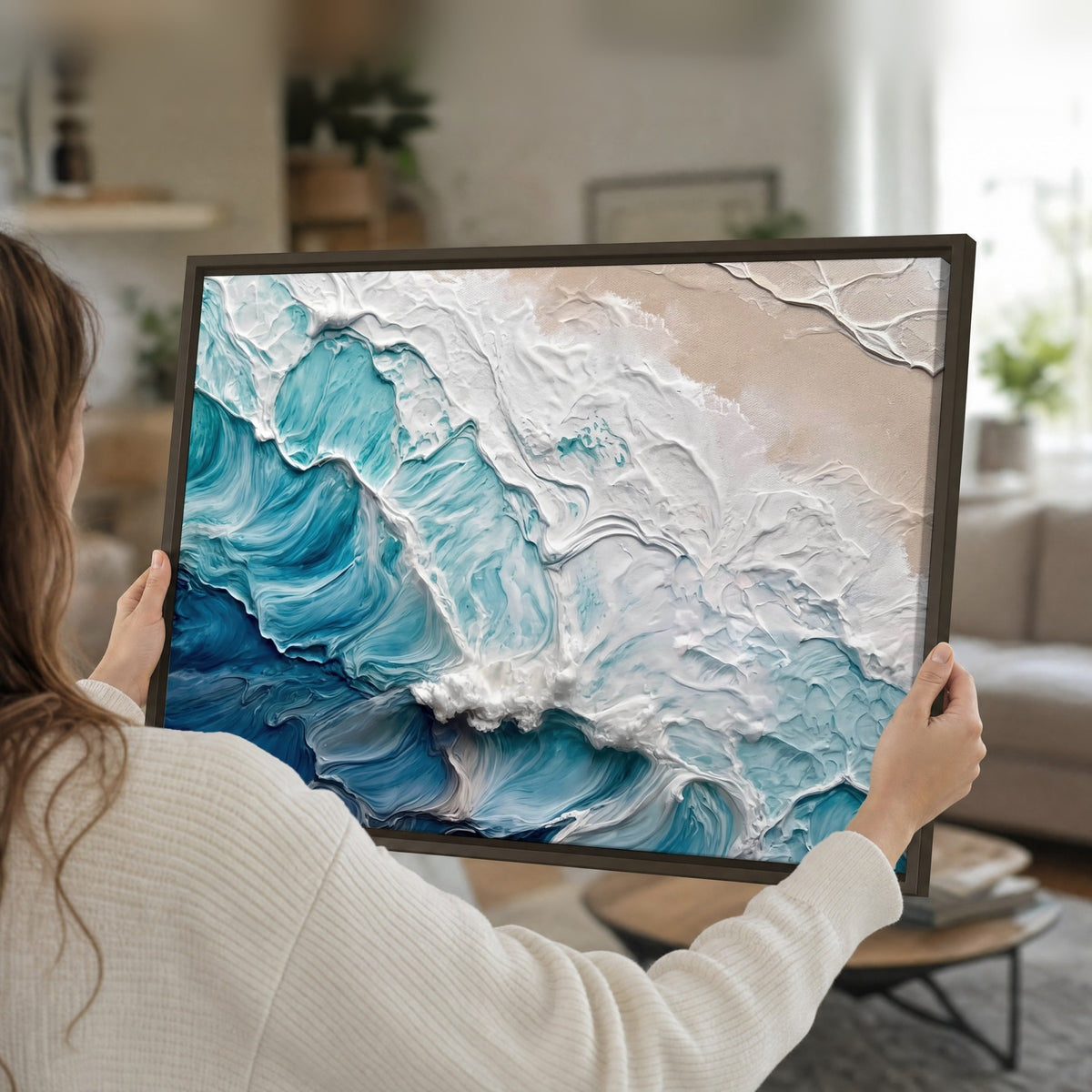 Turquoise ocean wave painting framed canvas held in hands
