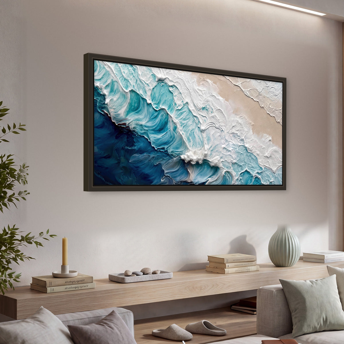 Turquoise ocean wave painting framed canvas wall art in a living room above a console