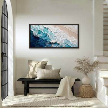 Turquoise ocean wave painting framed canvas wall art in an entryway above a bench