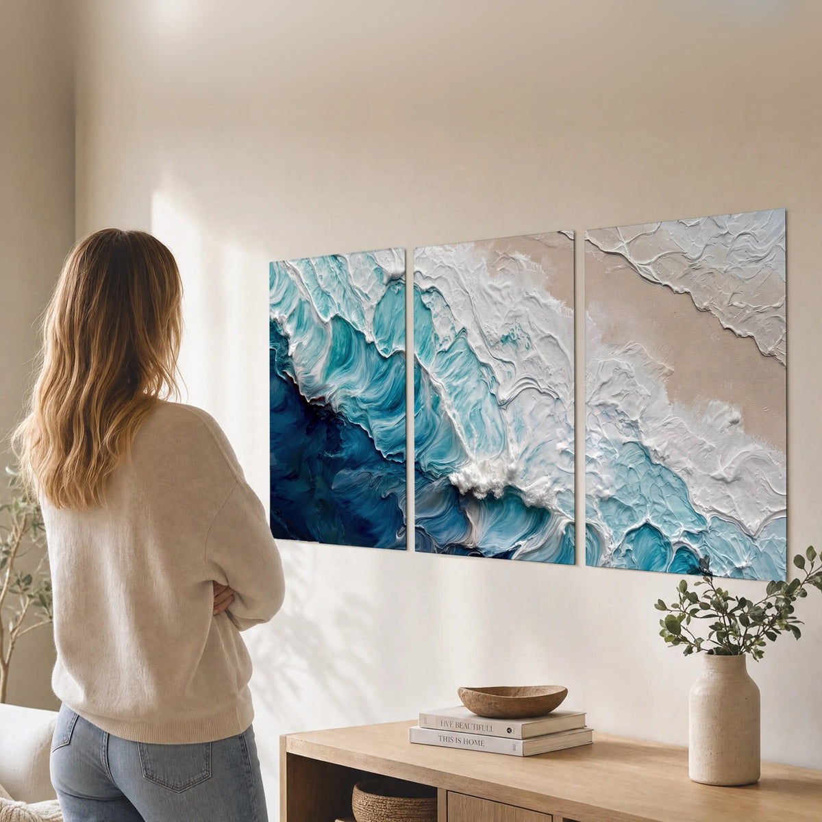 Turquoise ocean wave painting set of 3 poster prints in a living room