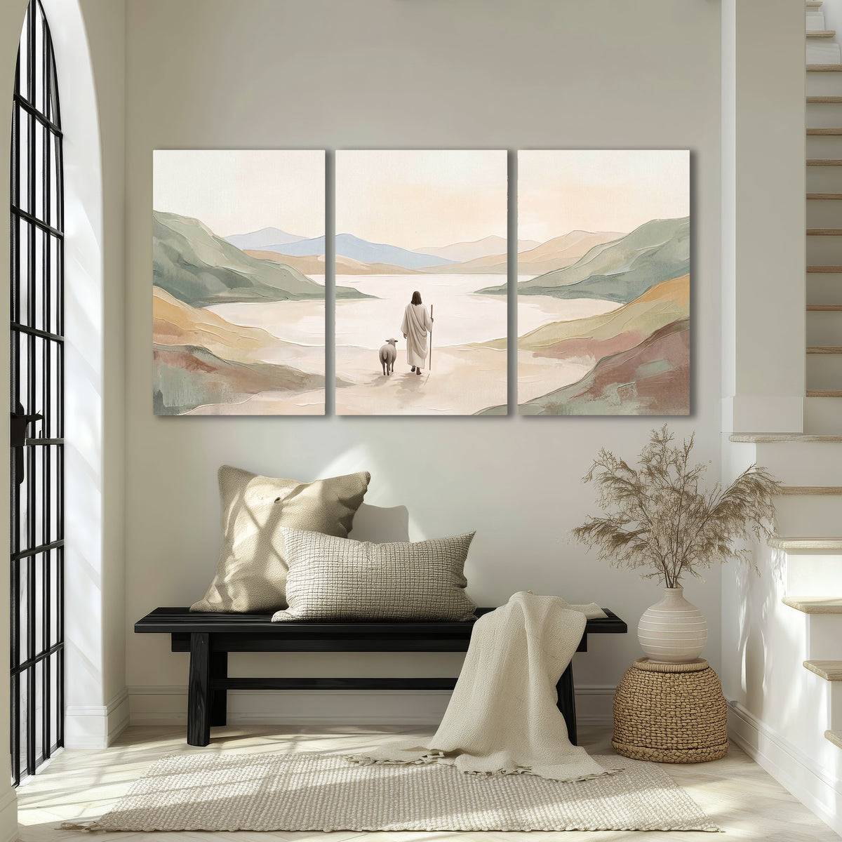 Minimalist Good Shepherd painting 3 piece canvas wall art in an entryway above a bench