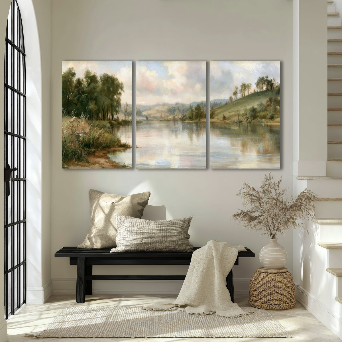 Pastel river valley painting 3 piece canvas wall art in an entryway above a bench
