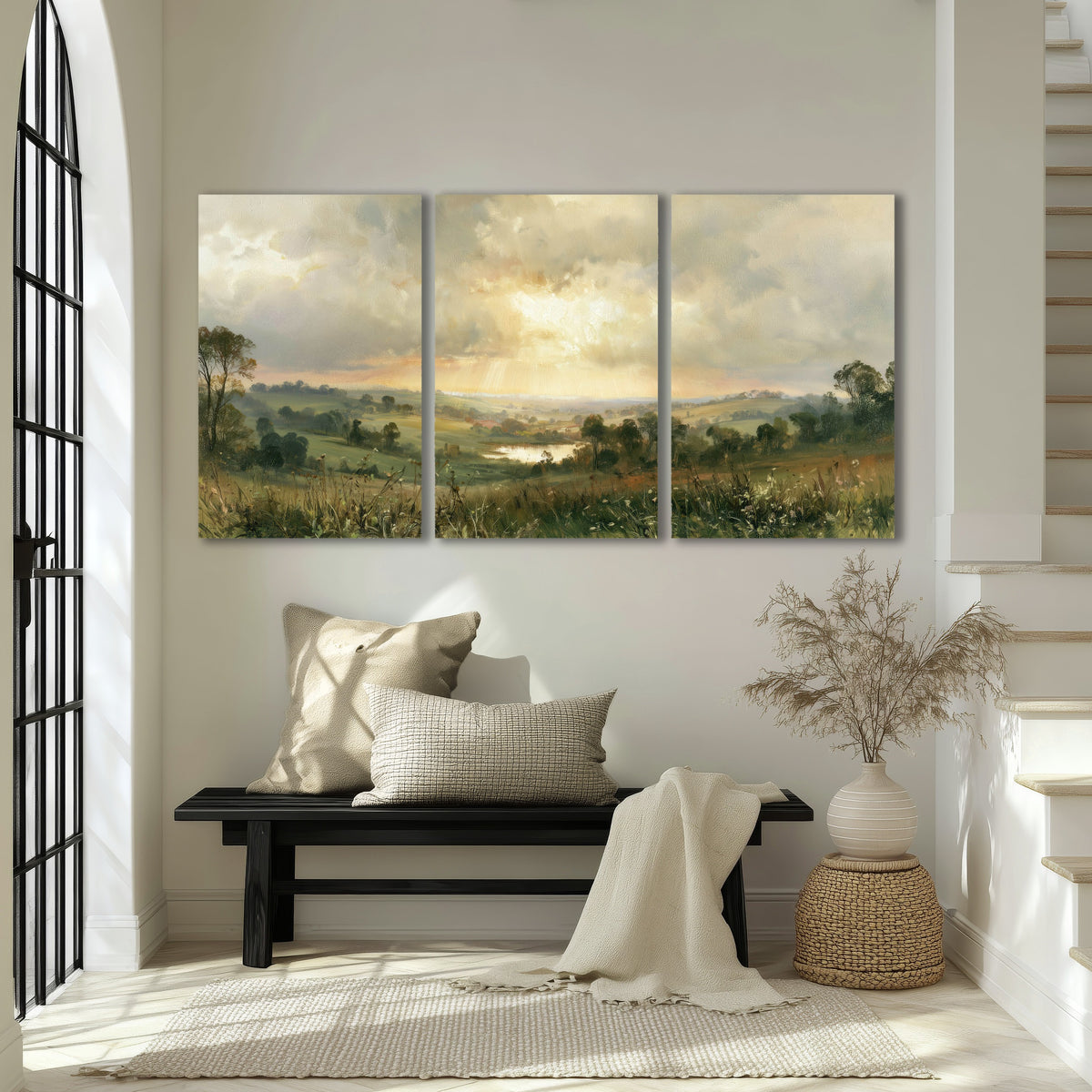 Sunbeams over countryside painting 3 piece canvas wall art in an entryway above a bench