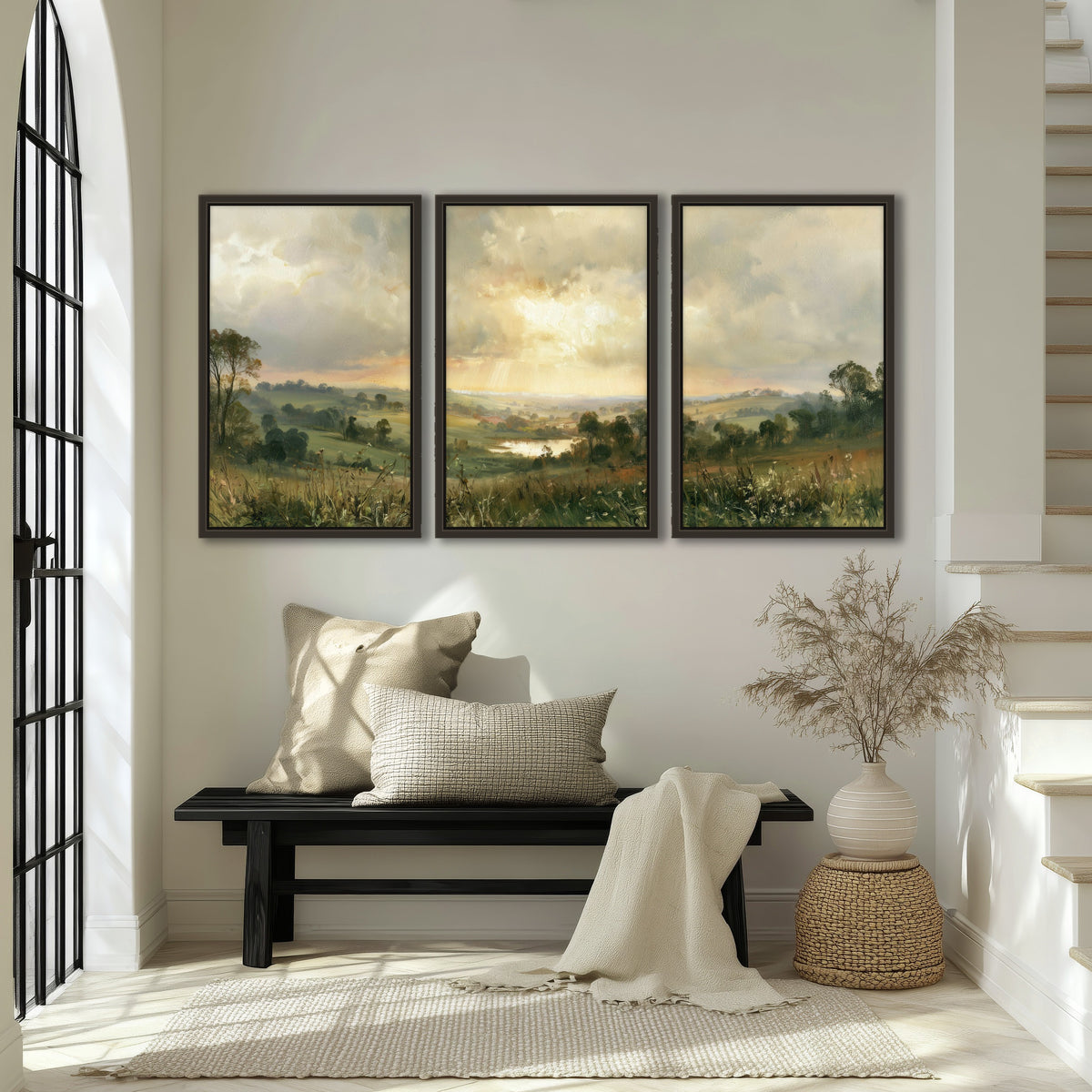 Sunbeams over countryside painting 3 piece framed canvas in an entryway above a bench