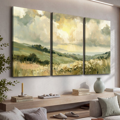 Sunlit meadow hills painting 3 piece canvas wall art in a living room above a console