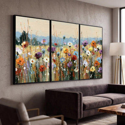 Colorful wildflower meadow painting 3 piece canvas wall art in a modern living room