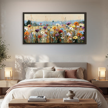 Colorful wildflower meadow painting framed canvas wall art in a bedroom above the bed