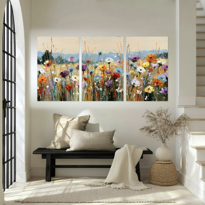 Colorful wildflower meadow painting set of 3 poster prints in an entryway above a bench