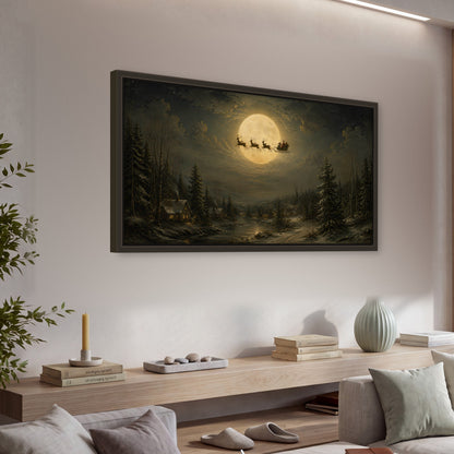 Santa sleigh full moon painting framed canvas wall art in a living room above a console