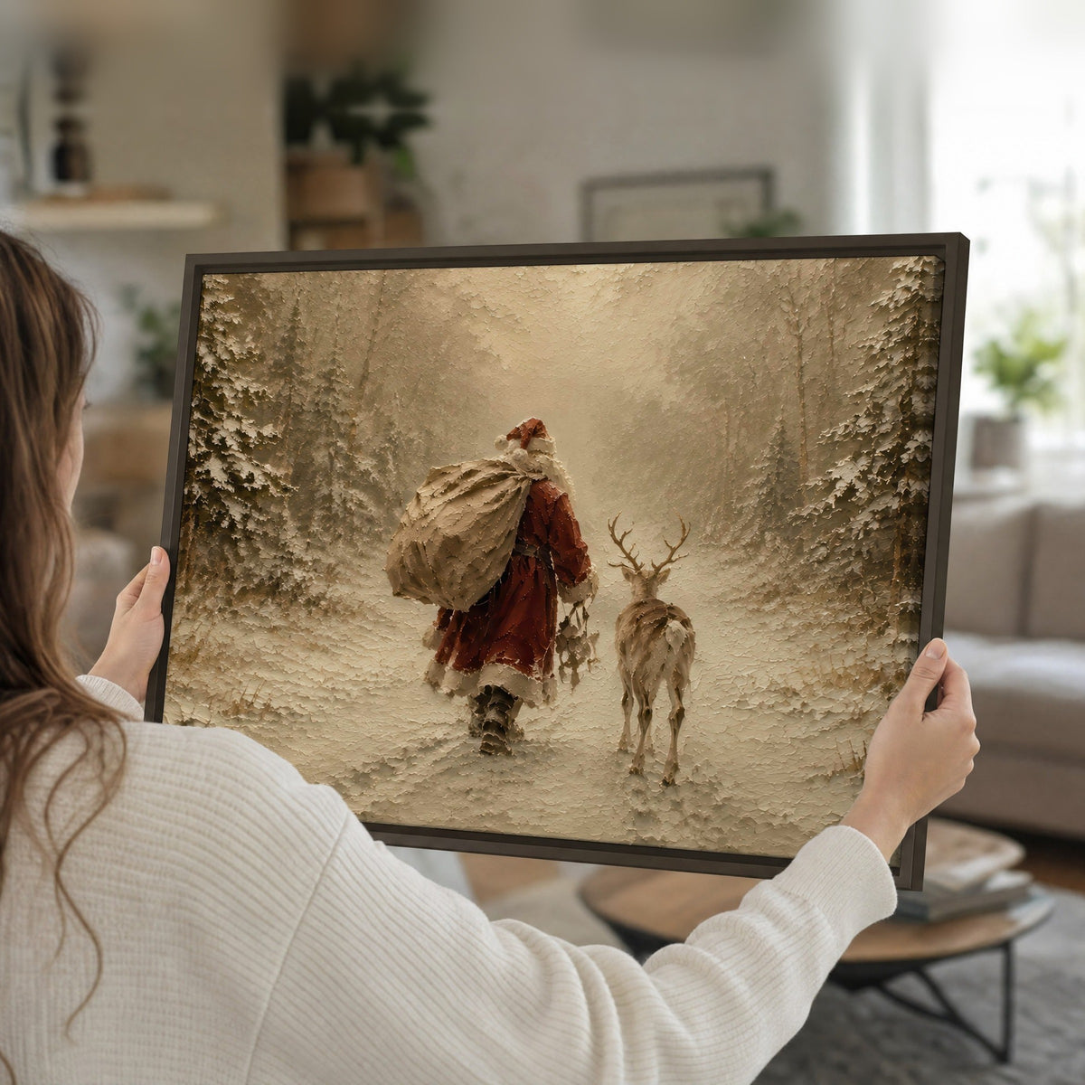 Santa and reindeer painting framed canvas held in hands