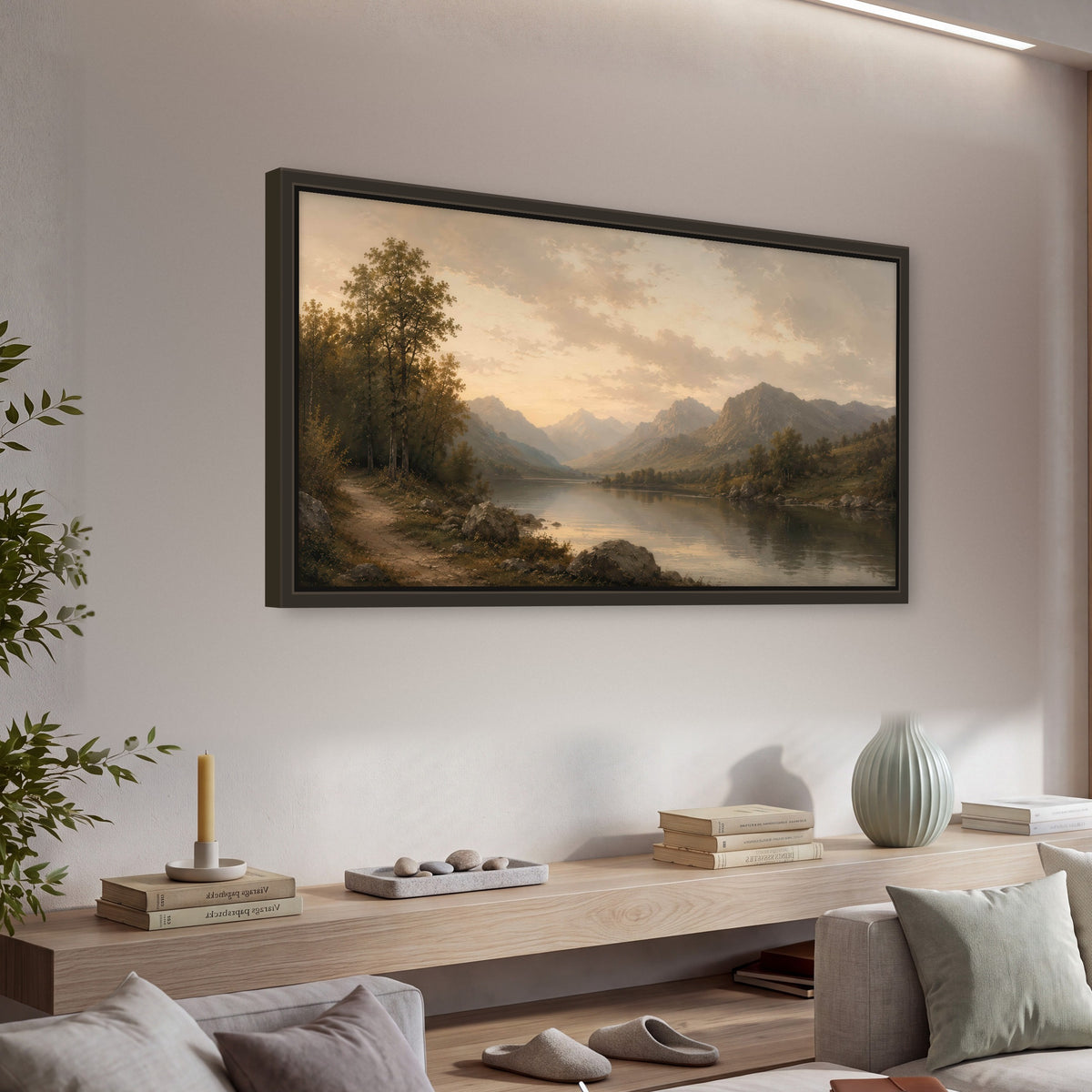Golden mountain lake painting framed canvas wall art in a living room above a console