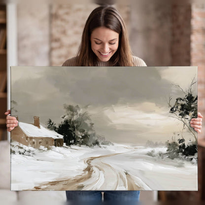 Neutral winter cottage painting canvas wall art held in hands