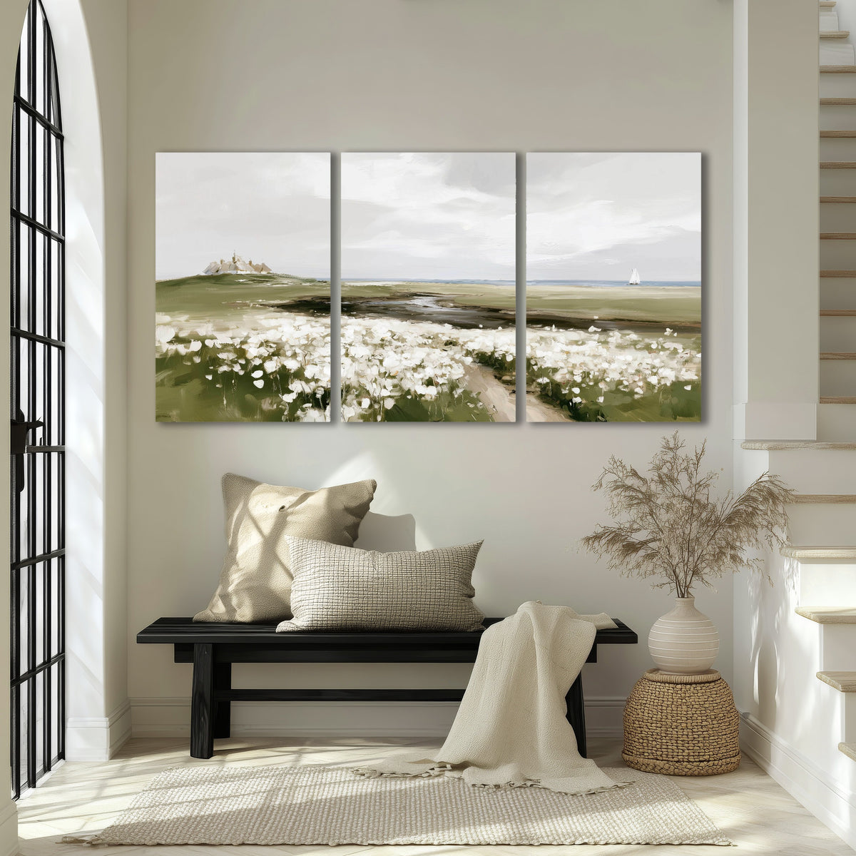 Coastal wildflower meadow painting 3 piece canvas wall art in an entryway above a bench