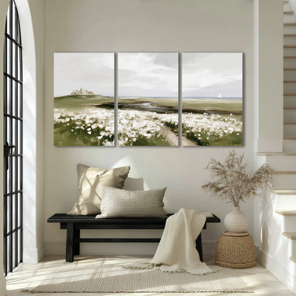 Coastal wildflower meadow painting 3 piece canvas wall art in an entryway above a bench
