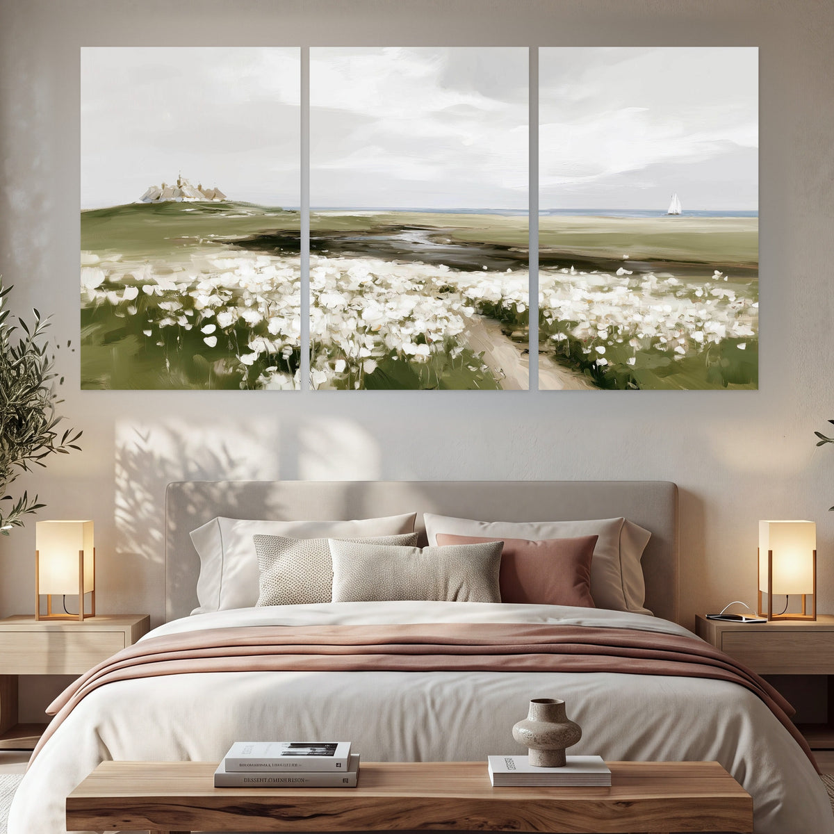 Coastal wildflower meadow painting set of 3 poster prints in a bedroom above the bed