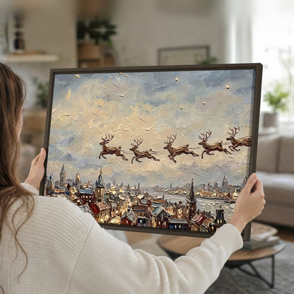 Santa sleigh over city painting framed canvas held in hands