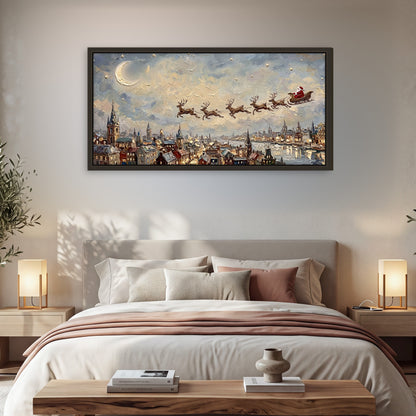 Santa sleigh over city painting framed canvas wall art in a bedroom above the bed