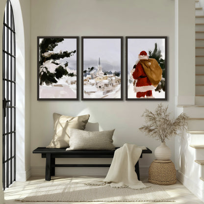 Santa Claus snowy village painting 3 piece framed canvas in an entryway above a bench