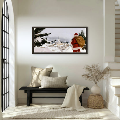 Santa Claus snowy village painting framed canvas wall art in an entryway above a bench
