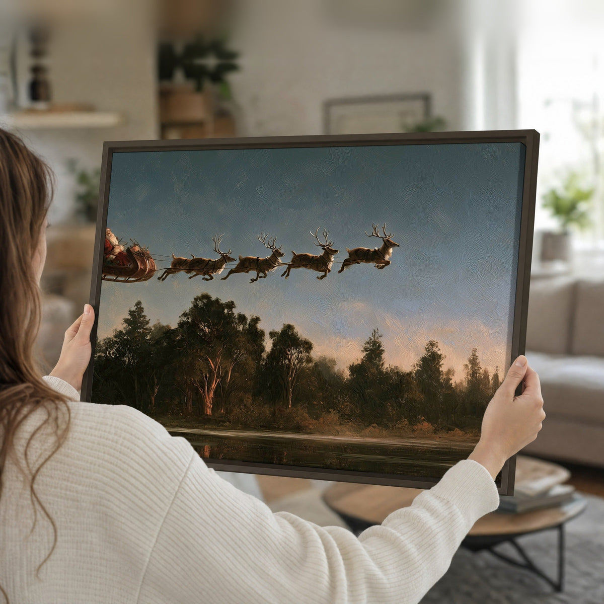 Santa sleigh at dusk painting framed canvas held in hands