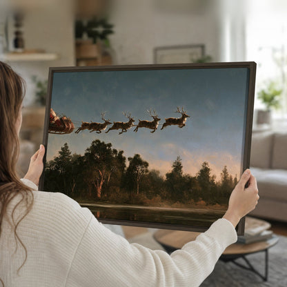 Santa sleigh at dusk painting framed canvas held in hands