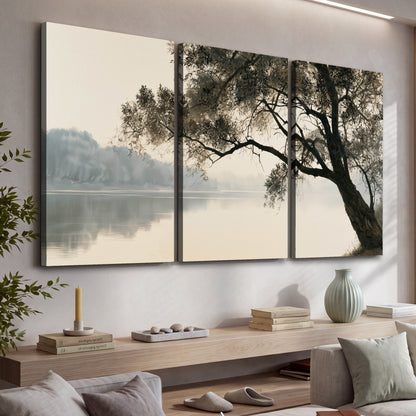 Tree silhouette misty lake painting 3 piece canvas wall art in a living room above a console