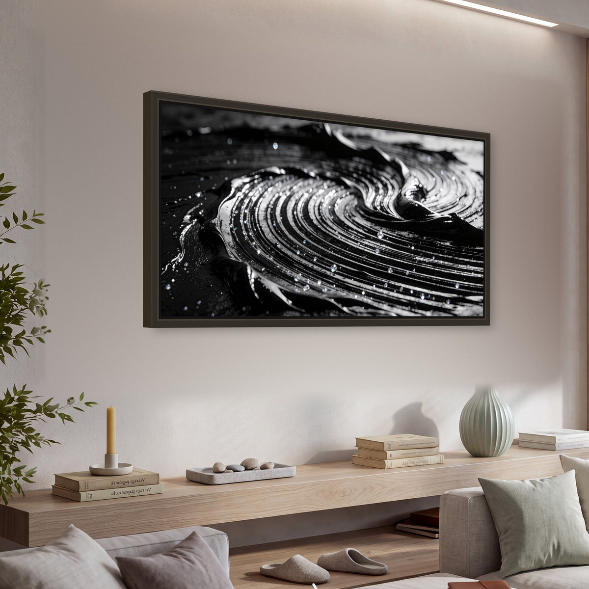 Black and silver swirl abstract painting framed canvas wall art in a living room above a console