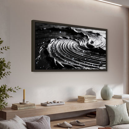 Black and silver swirl abstract painting framed canvas wall art in a living room above a console
