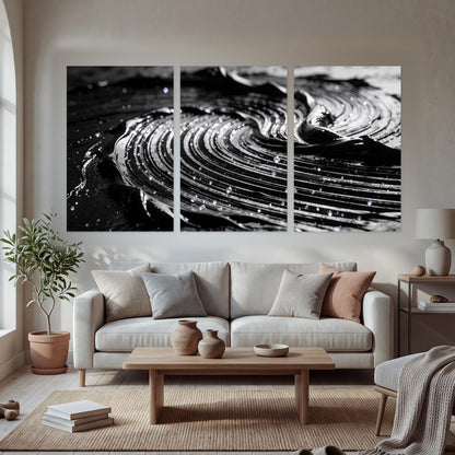 Black and silver swirl abstract painting set of 3 poster prints in a bright living room