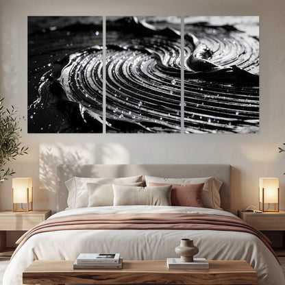 Black and silver swirl abstract painting set of 3 poster prints in a bedroom above the bed