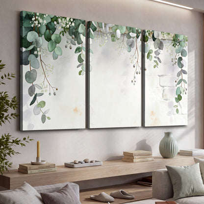 Watercolor eucalyptus greenery painting 3 piece canvas wall art in a living room above a console