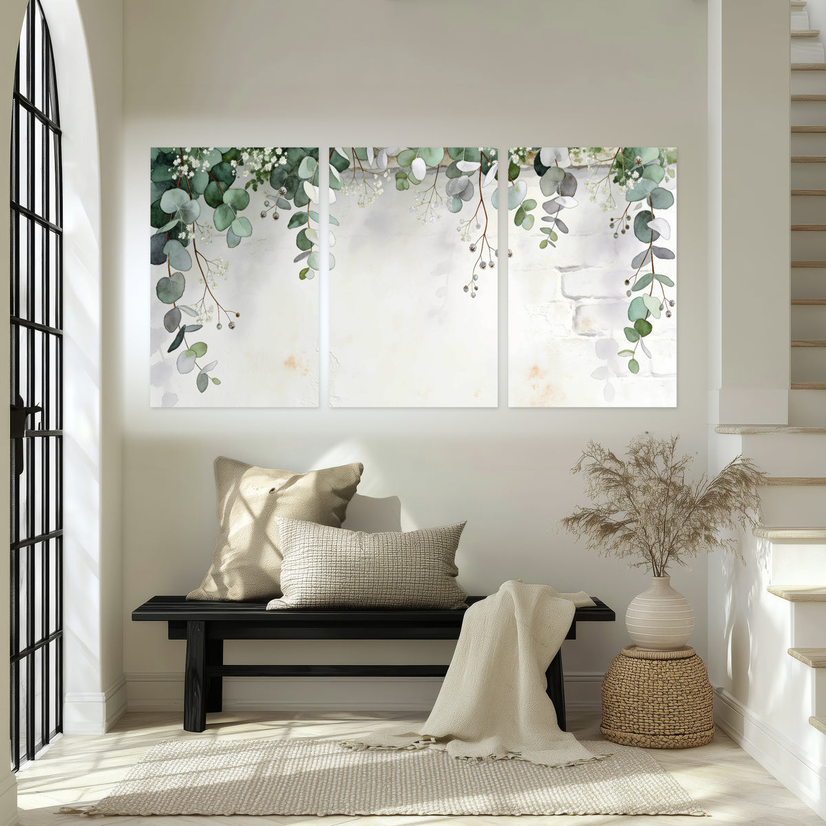 Watercolor eucalyptus greenery painting set of 3 poster prints in an entryway above a bench