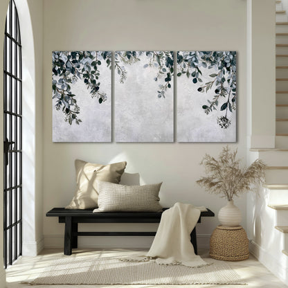 Eucalyptus leaves painting 3 piece canvas wall art in an entryway above a bench
