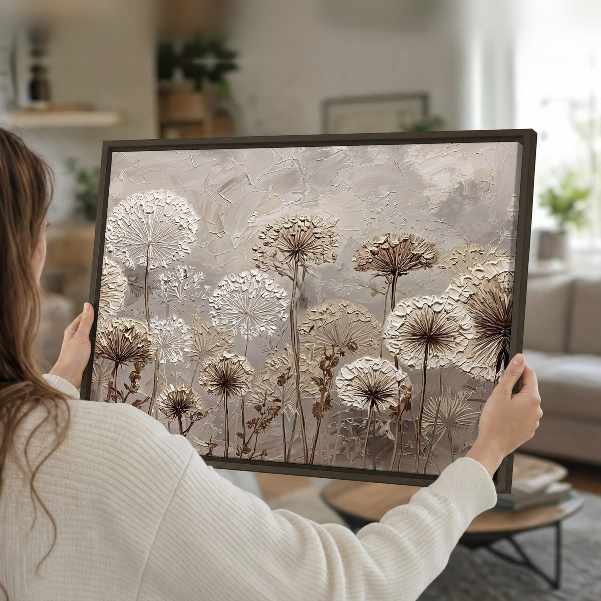 Textured dandelion painting framed canvas held in hands