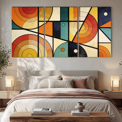 Mid century geometric abstract painting 3 piece canvas wall art in a bedroom above the bed