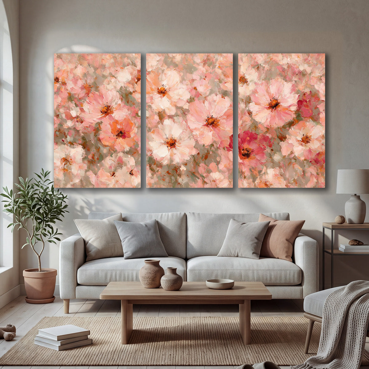 Blush pink flowers painting 3 piece canvas wall art in a bright living room