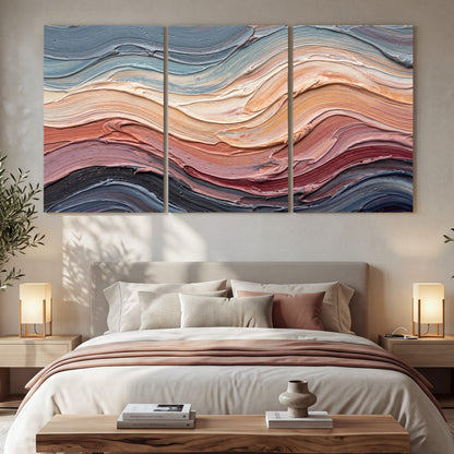 Pastel waves textured abstract painting 3 piece canvas wall art in a bedroom above the bed