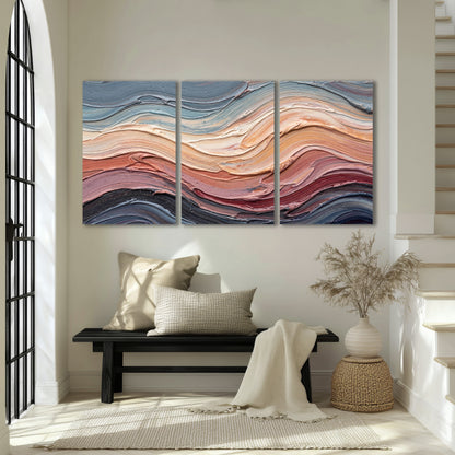 Pastel waves textured abstract painting 3 piece canvas wall art in an entryway above a bench
