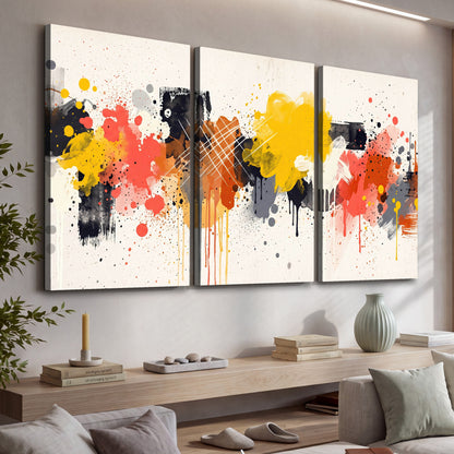 Paint splash abstract painting 3 piece canvas wall art in a living room above a console