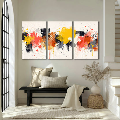 Paint splash abstract painting 3 piece canvas wall art in an entryway above a bench