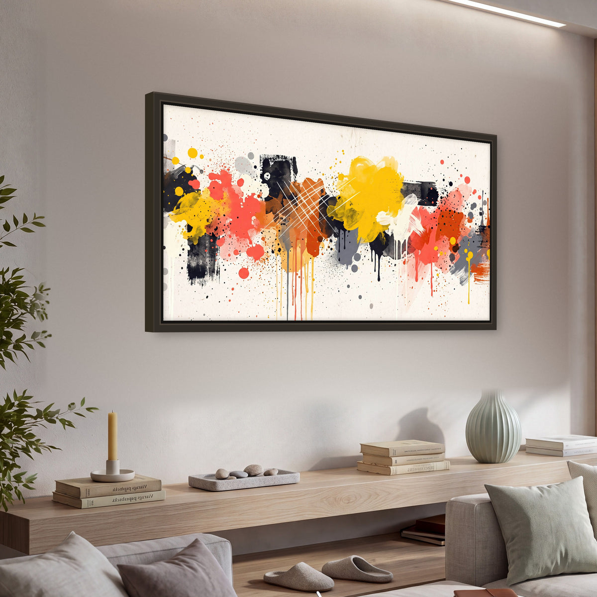Paint splash abstract painting framed canvas wall art in a living room above a console