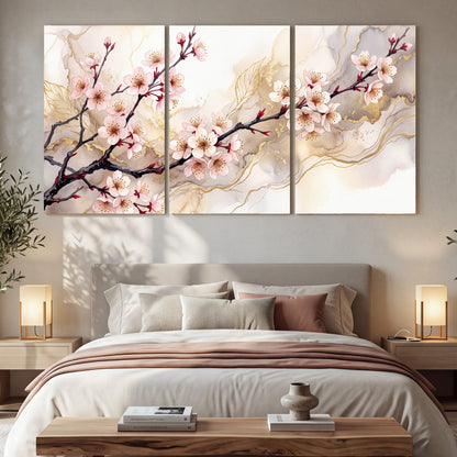 Cherry blossom branch with gold painting 3 piece canvas wall art in a bedroom above the bed