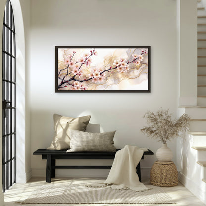 Cherry blossom branch with gold painting framed canvas wall art in an entryway above a bench