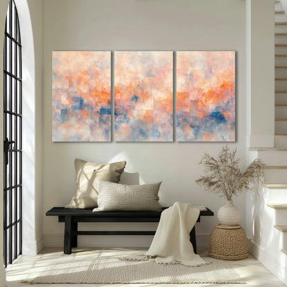 Peach and blue abstract painting 3 piece canvas wall art in an entryway above a bench