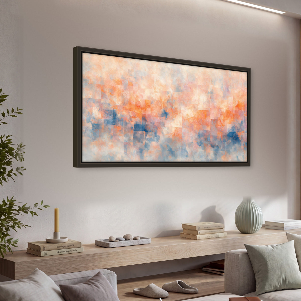 Peach and blue abstract painting framed canvas wall art in a living room above a console