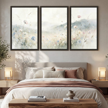Watercolor wildflower meadow painting 3 piece framed canvas in a bedroom above the bed