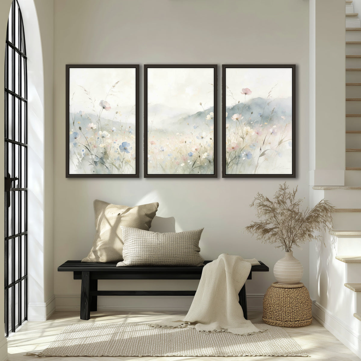 Watercolor wildflower meadow painting 3 piece framed canvas in an entryway above a bench